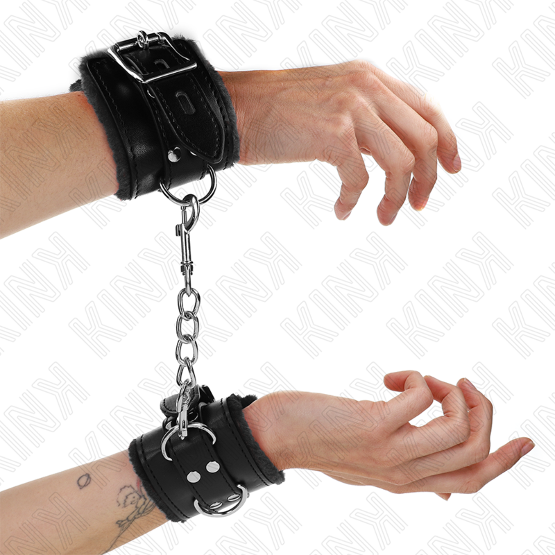 KINK – APPUI-POIGNETS DOUBLÉS DE FOURRURE NOIR AVEC CEINTURE NOIRE RÉGLABLE 17-29 CM X 6 CM